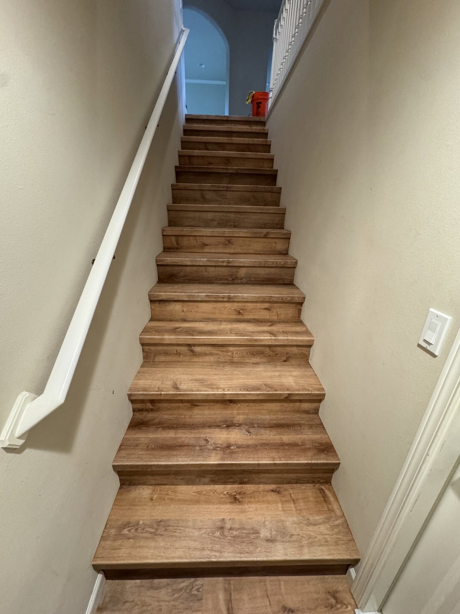 Hardwood stair installation in progress by MG Flooring